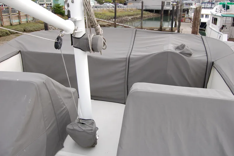  Yacht Photos Pics 1981 Willard Marine Pilot House Trawler deck with protective covers in a marina setting.