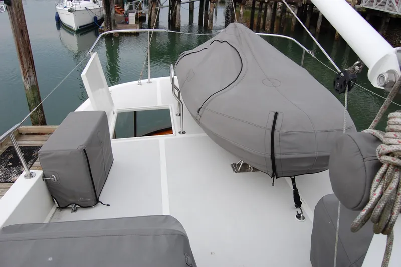  Yacht Photos Pics 1981 Willard Marine Pilot House Trawler deck with covered equipment and dock view.