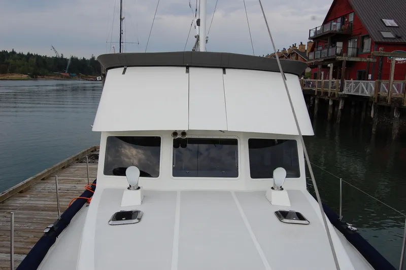  Yacht Photos Pics 1981 Willard Marine Pilot House Trawler docked near waterfront buildings.