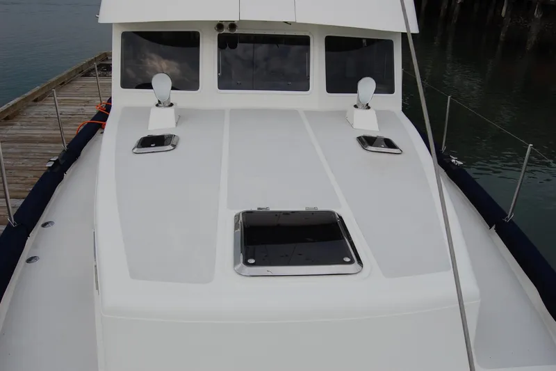  Yacht Photos Pics 1981 Willard Marine Pilot House Trawler docked, showcasing deck and cabin windows.