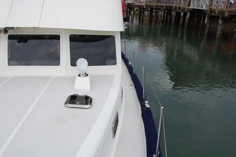  Yacht Photos Pics 1981 Willard Marine Pilot House Trawler docked, showcasing deck and windows.