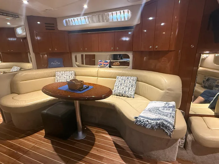  Yacht Photos Pics Luxurious interior of 2003 Sea Ray 380 Sundancer yacht with leather seating and wooden cabinetry.