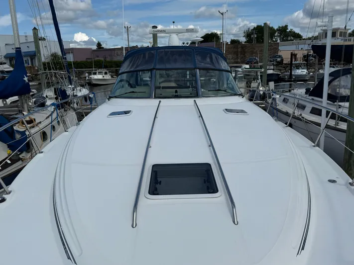  Yacht Photos Pics 2003 Sea Ray 380 Sundancer yacht docked at marina, showcasing sleek deck design.