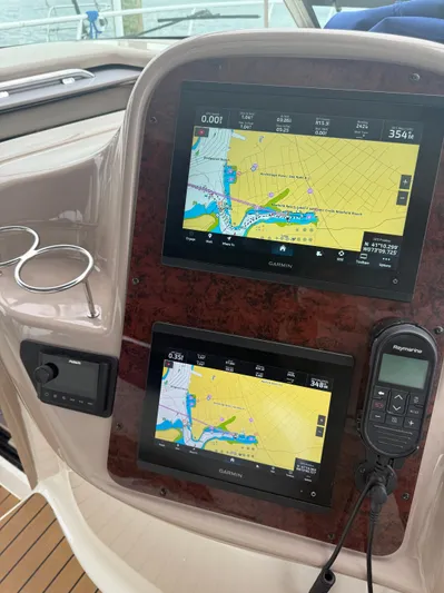  Yacht Photos Pics Control panel of a 2003 Sea Ray 380 Sundancer with Garmin navigation displays.