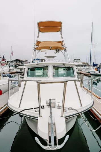  Yacht Photos Pics 2017 Parker 2520 XLD Sport Cabin boat docked in marina.