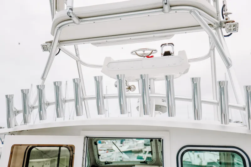  Yacht Photos Pics 2017 Parker 2520 XLD Sport Cabin boat with rod holders and upper helm station.