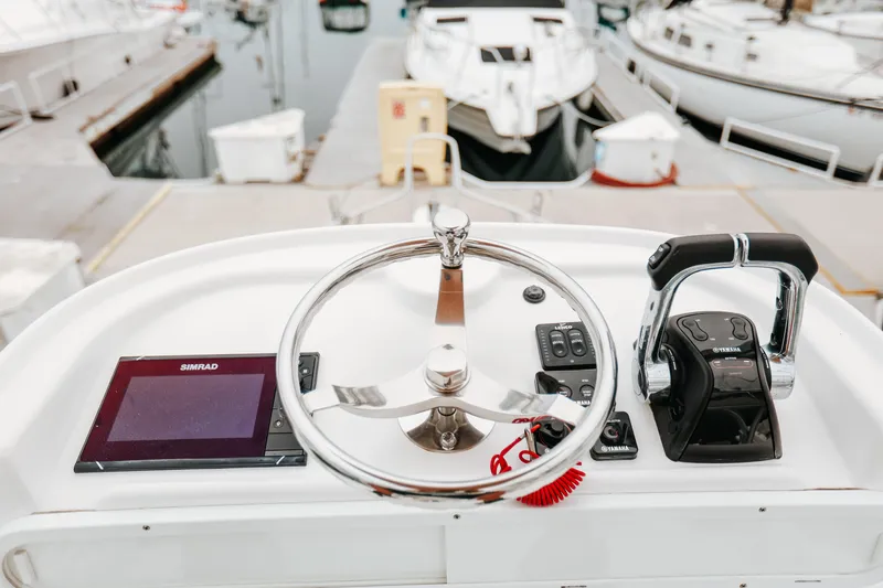  Yacht Photos Pics Steering console of 2017 Parker 2520 XLD Sport Cabin boat with Simrad display and Yamaha controls.