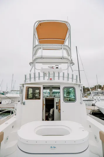  Yacht Photos Pics 2017 Parker 2520 XLD Sport Cabin boat docked at marina, rear view.