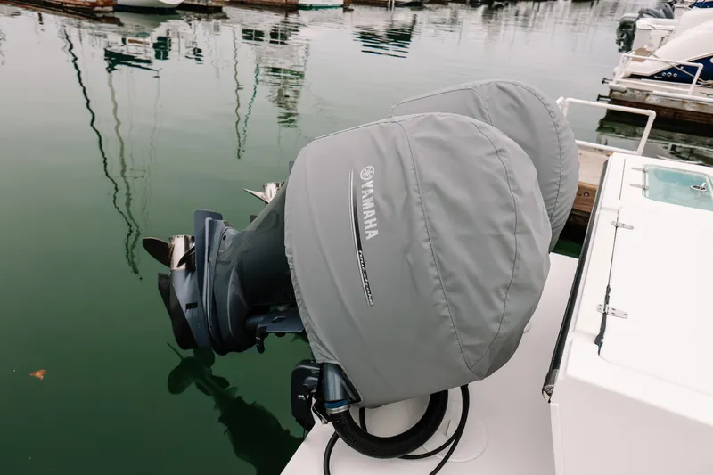  Yacht Photos Pics Twin Yamaha outboard motors on a 2017 Parker 2520 XLD Sport Cabin boat at a marina.