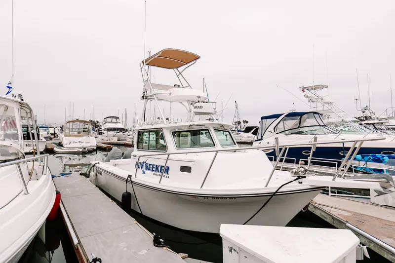  Yacht Photos Pics 2017 Parker 2520 XLD Sport Cabin boat docked in a marina.