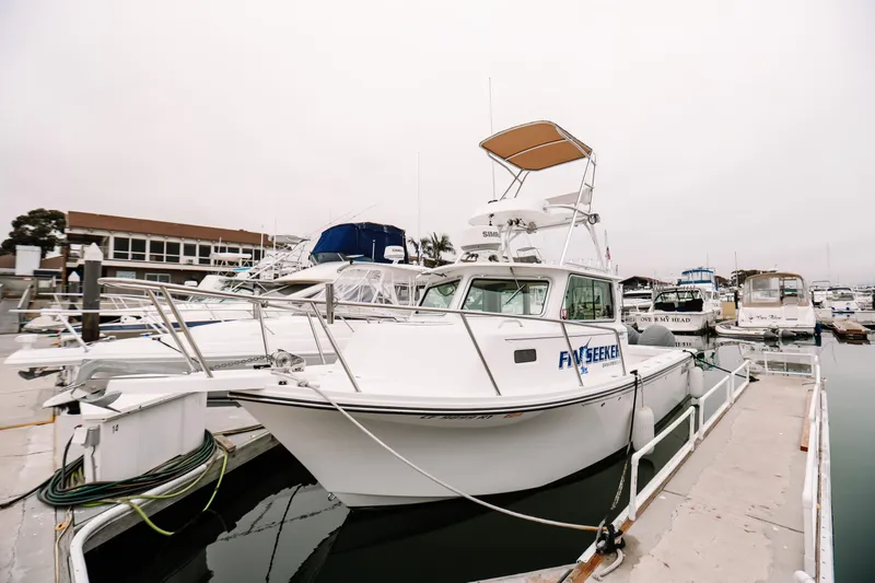  Yacht Photos Pics 2017 Parker 2520 XLD Sport Cabin boat docked at marina.