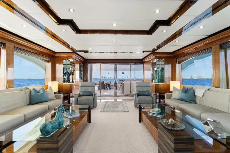 Mesmerize Yacht Photos Pics Luxurious interior of 2013 Hargrave 125 Raised Pilothouse yacht with elegant seating and ocean views.