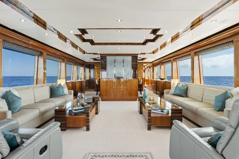 Mesmerize Yacht Photos Pics Luxurious interior of 2013 Hargrave 125 Raised Pilothouse yacht with elegant seating and ocean views.