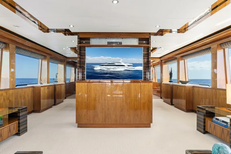 Mesmerize Yacht Photos Pics Luxurious interior of 2013 Hargrave 125 Raised Pilothouse yacht with elegant wood finishes.