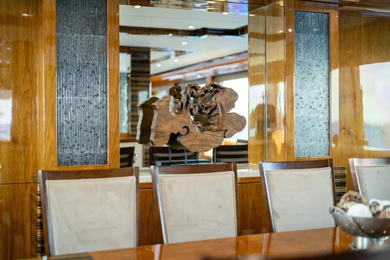 Mesmerize Yacht Photos Pics Luxurious dining area on 2013 Hargrave 125 Raised Pilothouse yacht with elegant decor.