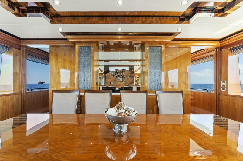Mesmerize Yacht Photos Pics Luxurious dining area on 2013 Hargrave 125 Raised Pilothouse yacht with elegant wood finishes.