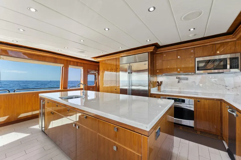 Mesmerize Yacht Photos Pics Luxurious kitchen interior on 2013 Hargrave 125 Raised Pilothouse yacht with ocean view.