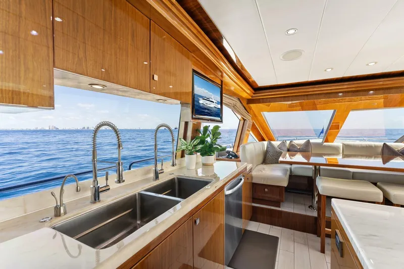 Mesmerize Yacht Photos Pics Luxurious interior of 2013 Hargrave 125 Raised Pilothouse yacht with ocean view.