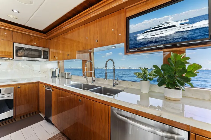 Mesmerize Yacht Photos Pics Luxurious kitchen interior of 2013 Hargrave 125 Raised Pilothouse yacht with ocean view.