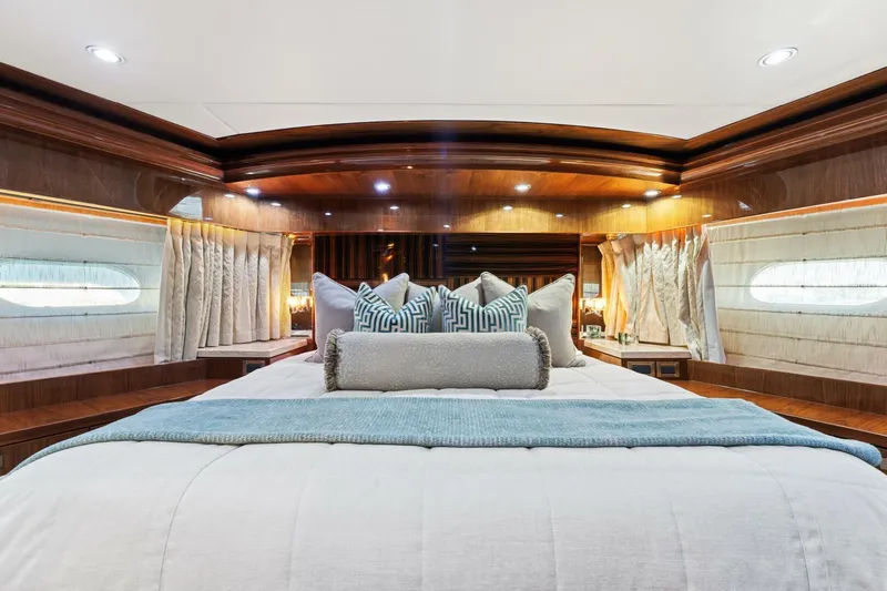 Mesmerize Yacht Photos Pics Luxurious bedroom interior of 2013 Hargrave 125 Raised Pilothouse yacht with elegant wood finishes.