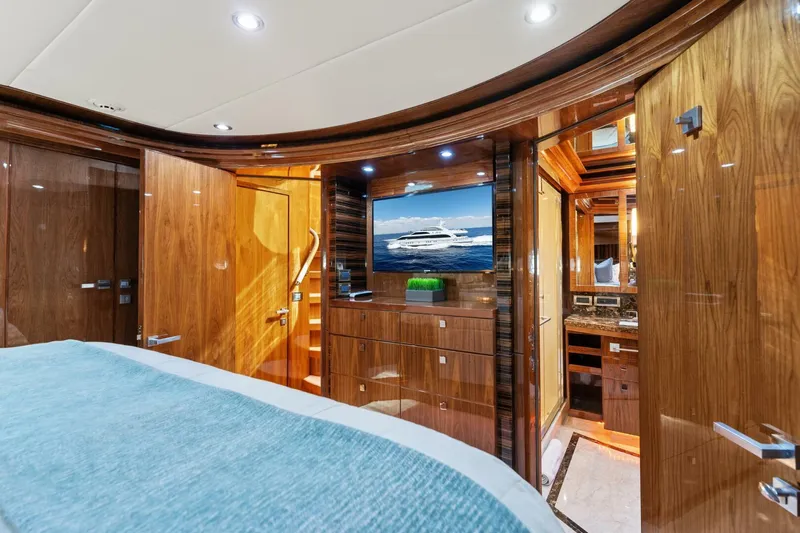 Mesmerize Yacht Photos Pics Luxurious cabin interior of 2013 Hargrave 125 Raised Pilothouse yacht with wood finishes.
