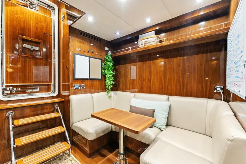 Mesmerize Yacht Photos Pics Luxurious interior of 2013 Hargrave 125 Raised Pilothouse yacht with elegant wood paneling.