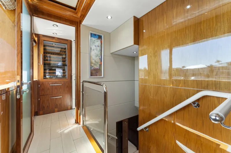 Mesmerize Yacht Photos Pics Luxurious interior of 2013 Hargrave 125 Raised Pilothouse yacht with wood finishes and modern design.