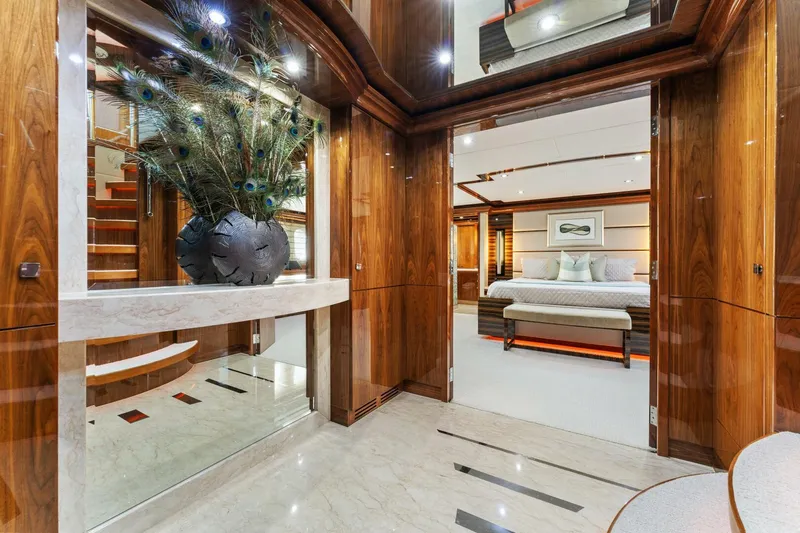 Mesmerize Yacht Photos Pics Luxurious interior of 2013 Hargrave 125 Raised Pilothouse yacht with elegant wood finishes and modern decor.