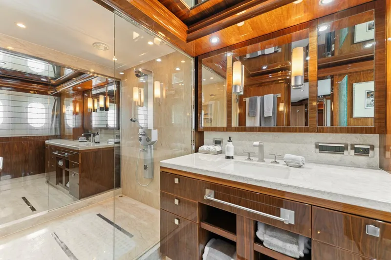 Mesmerize Yacht Photos Pics Luxurious bathroom in 2013 Hargrave 125 Raised Pilothouse yacht with elegant wood finishes.