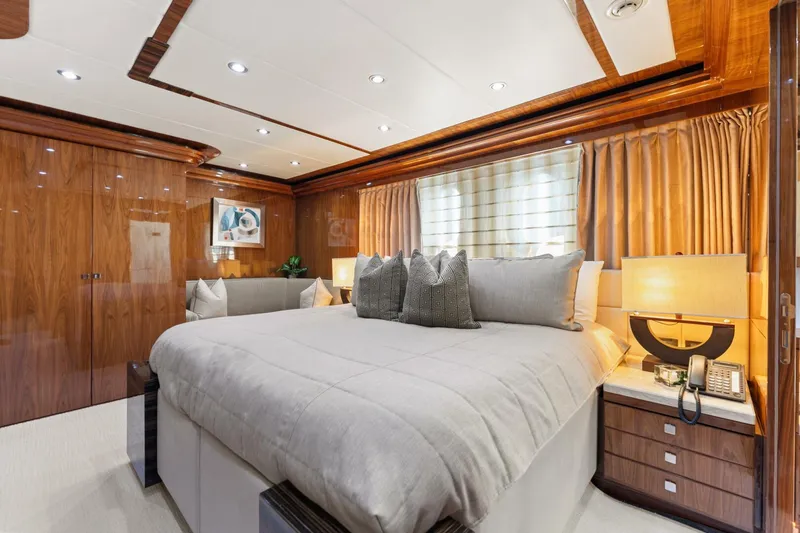 Mesmerize Yacht Photos Pics Luxurious bedroom in 2013 Hargrave 125 Raised Pilothouse yacht with elegant wood finishes.