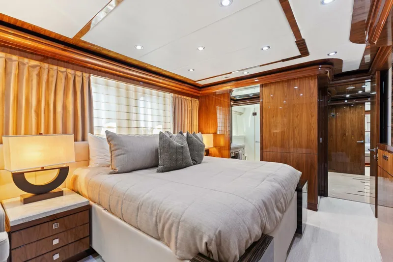 Mesmerize Yacht Photos Pics Luxurious bedroom interior of 2013 Hargrave 125 Raised Pilothouse yacht with elegant wood finishes.
