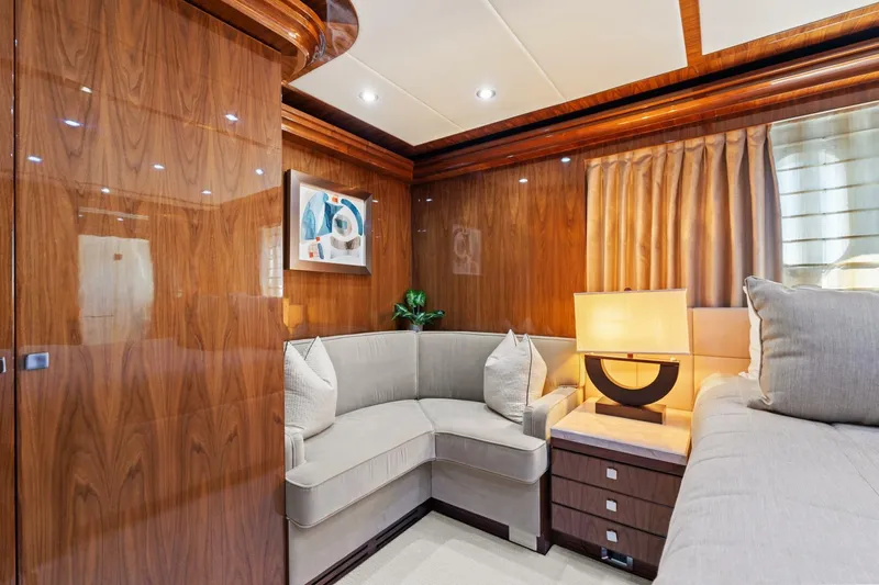 Mesmerize Yacht Photos Pics Luxurious interior of 2013 Hargrave 125 Raised Pilothouse yacht with elegant wood paneling.