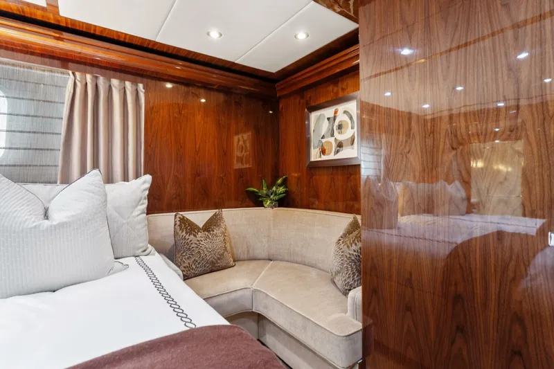 Mesmerize Yacht Photos Pics Luxurious cabin interior of 2013 Hargrave 125 Raised Pilothouse yacht with elegant wood paneling.