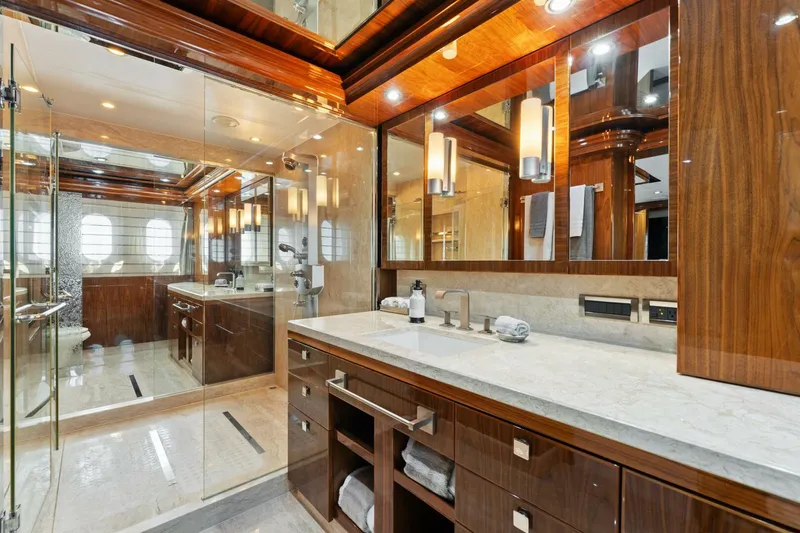 Mesmerize Yacht Photos Pics Luxurious bathroom in 2013 Hargrave 125 Raised Pilothouse yacht with elegant wood finishes.