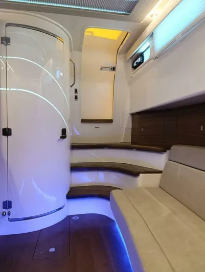  Yacht Photos Pics 2024 Boston Whaler 420 Outrage interior with modern seating and ambient lighting.