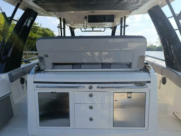  Yacht Photos Pics 2024 Boston Whaler 420 Outrage interior with sleek cabinetry and modern design.