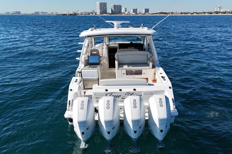 True Story Yacht Photos Pics 2022 Boston Whaler 380 Realm boat with four engines on open water.