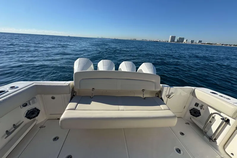 True Story Yacht Photos Pics 2022 Boston Whaler 380 Realm boat with seating, ocean view, and city skyline.