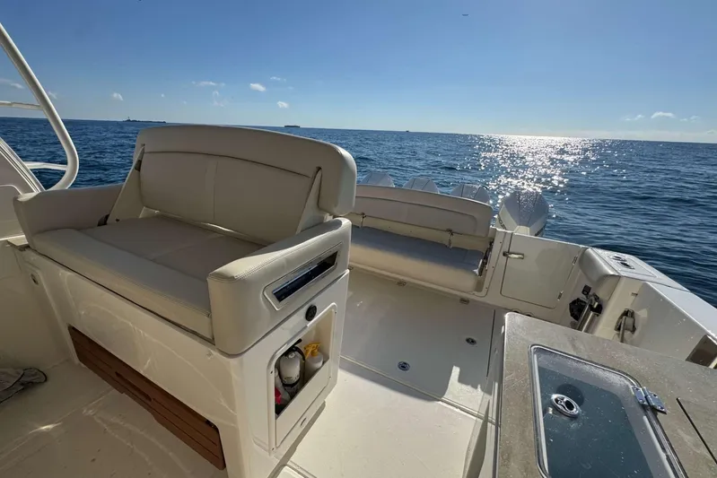 True Story Yacht Photos Pics 2022 Boston Whaler 380 Realm boat interior with ocean view and seating area.