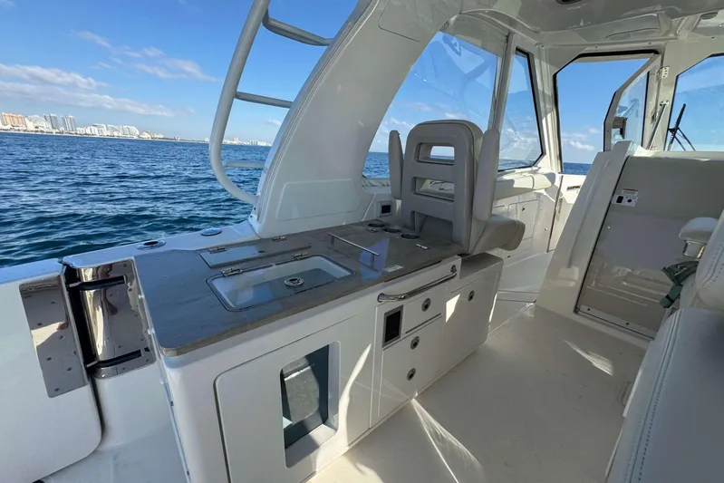 True Story Yacht Photos Pics 2022 Boston Whaler 380 Realm interior with ocean view, featuring sleek design and modern amenities.