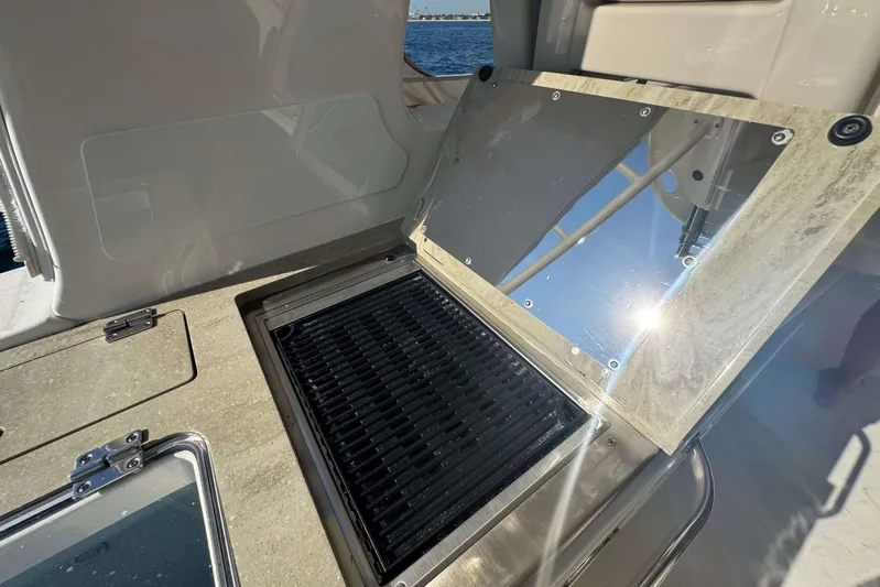 True Story Yacht Photos Pics Outdoor grill on 2022 Boston Whaler 380 Realm boat, featuring sleek design and stainless steel finish.