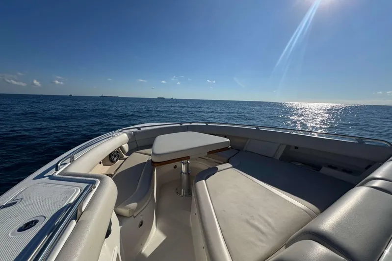True Story Yacht Photos Pics 2022 Boston Whaler 380 Realm boat interior with ocean view under clear blue sky.