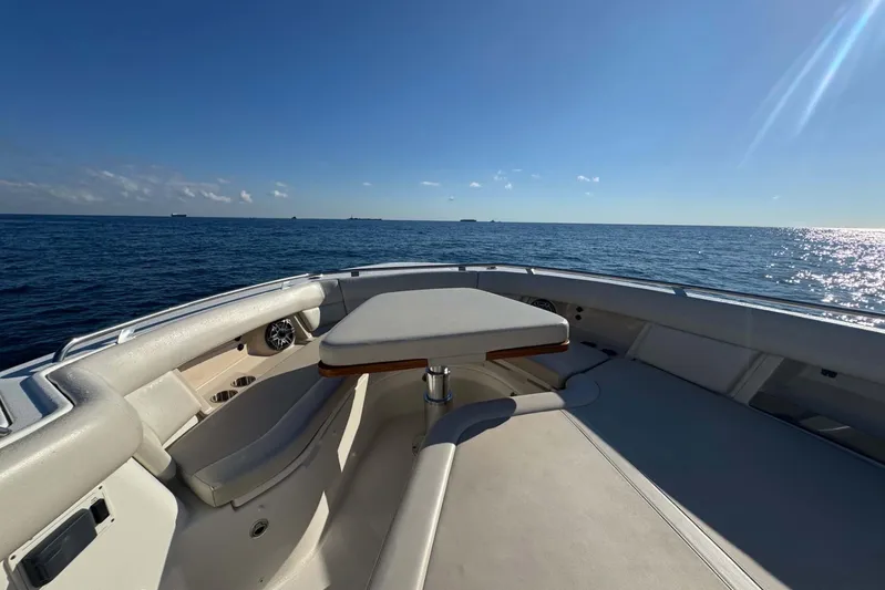 True Story Yacht Photos Pics 2022 Boston Whaler 380 Realm boat deck with ocean view under clear blue sky.
