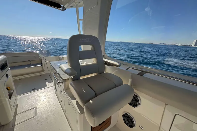 True Story Yacht Photos Pics 2022 Boston Whaler 380 Realm interior with ocean view, featuring luxurious seating.