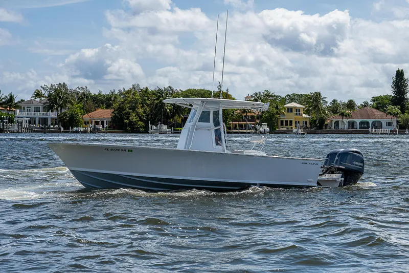  Yacht Photos Pics 1969 Bertram 25 Moppie boat cruising on a sunny day.