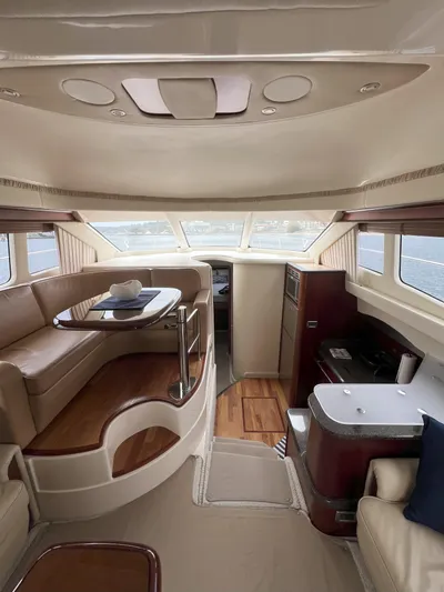 Viva La Vida Yacht Photos Pics Interior of 2006 Sea Ray 44 Sedan Bridge yacht with elegant seating and dining area.