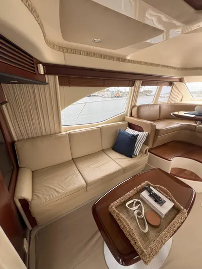 Viva La Vida Yacht Photos Pics Luxurious interior of 2006 Sea Ray 44 Sedan Bridge yacht with beige seating.