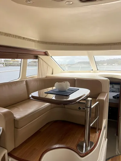 Viva La Vida Yacht Photos Pics Luxurious interior of 2006 Sea Ray 44 Sedan Bridge yacht with elegant seating and table.