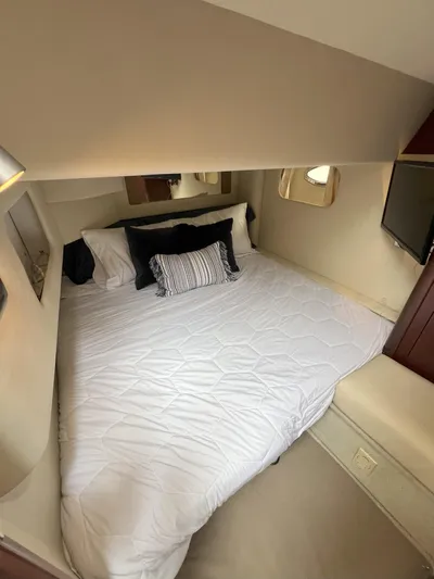 Viva La Vida Yacht Photos Pics Luxurious bedroom in 2006 Sea Ray 44 Sedan Bridge yacht with cozy bedding and modern decor.