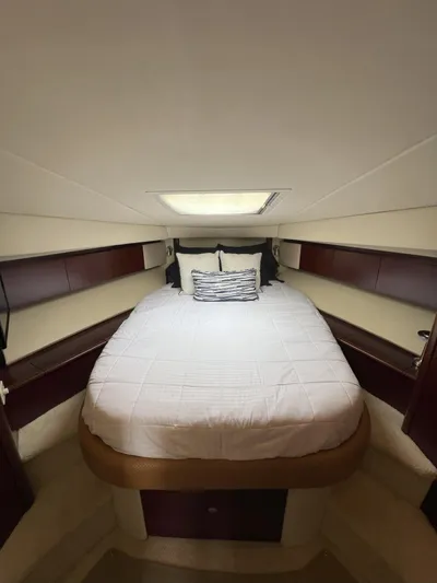 Viva La Vida Yacht Photos Pics 2006 Sea Ray 44 Sedan Bridge cabin with a cozy bed and elegant wood accents.